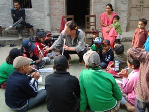 A Global Peace Festival Foundation volunteer connects with young Nepalese orphans at the Peace Children Home through music.