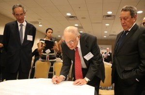 H.E. Mesa signs the Presidential Mission statement.