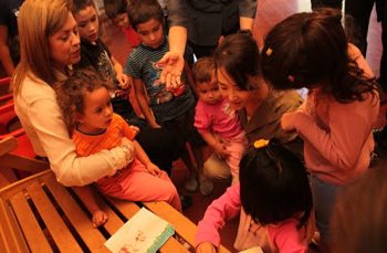 The children were excited to share their artwork with the visiting women.