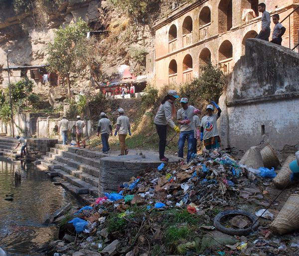 Volunteers clean refuse from the banks of the Bagmati River in Kathmandu.