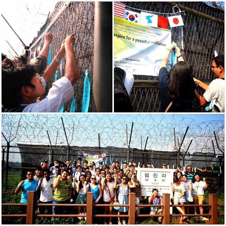 International and Korean students tie blue ribbons of hope on the barbed wire at Imjingak.