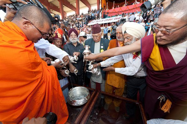 Religious leaders participate in the water ceremony during the Global Peace Festival in Nepal. 