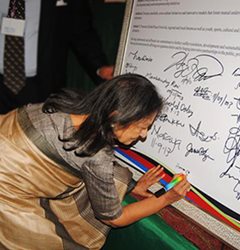 Mrs. Aruna Chandaria, co-chair of the Chandaria Foundation signs the Abuja Peace Declaration.