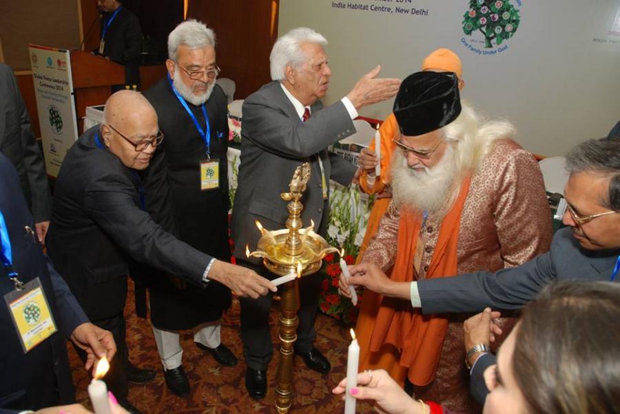Interfaith leaders lighting the candle at the commencement of the Global Peace Leadership Conference.