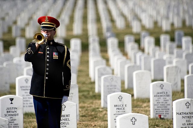A lone U.S. Army bugler plays Taps at the conclusion of the First Annual Remembrance Ceremony in Dedication to Fallen Military Medical Personnel at Arlington National Cemetery. (DoD photo by Mass Communication Specialist 1st Class Chad J. McNeeley/Released)