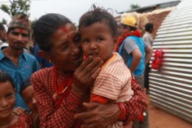 Women carrying her child, nepal, After 2015 earthquake