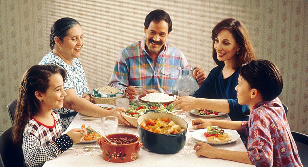 Family having dinner together happily