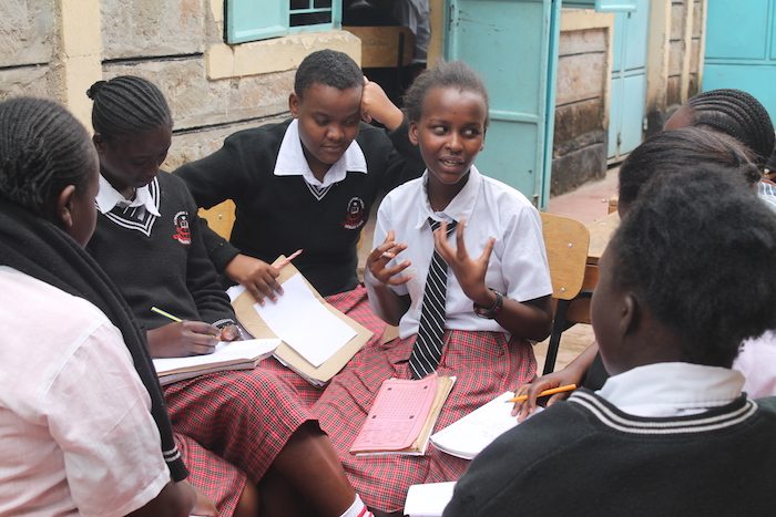 Girls discussing self-confidence and leadership at St. Thaddeus