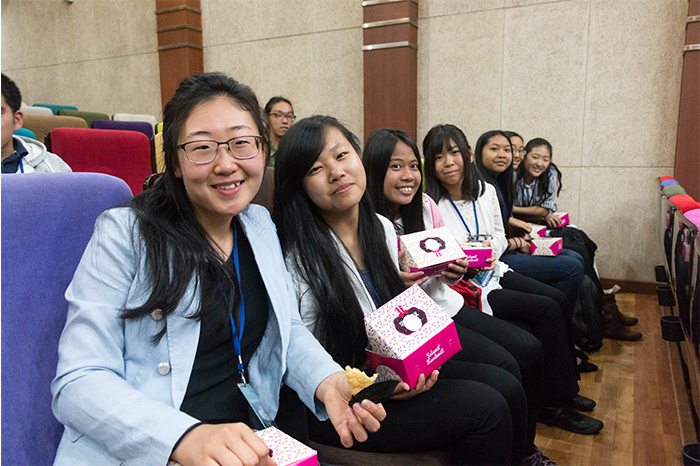 Ohnshim Kim (far left) sits with other youth of the Global Peace Youth Exchange